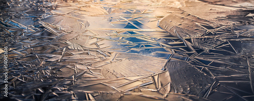 Ice forming on a puddle