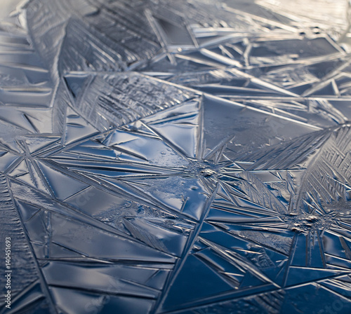 Ice forming on a puddle