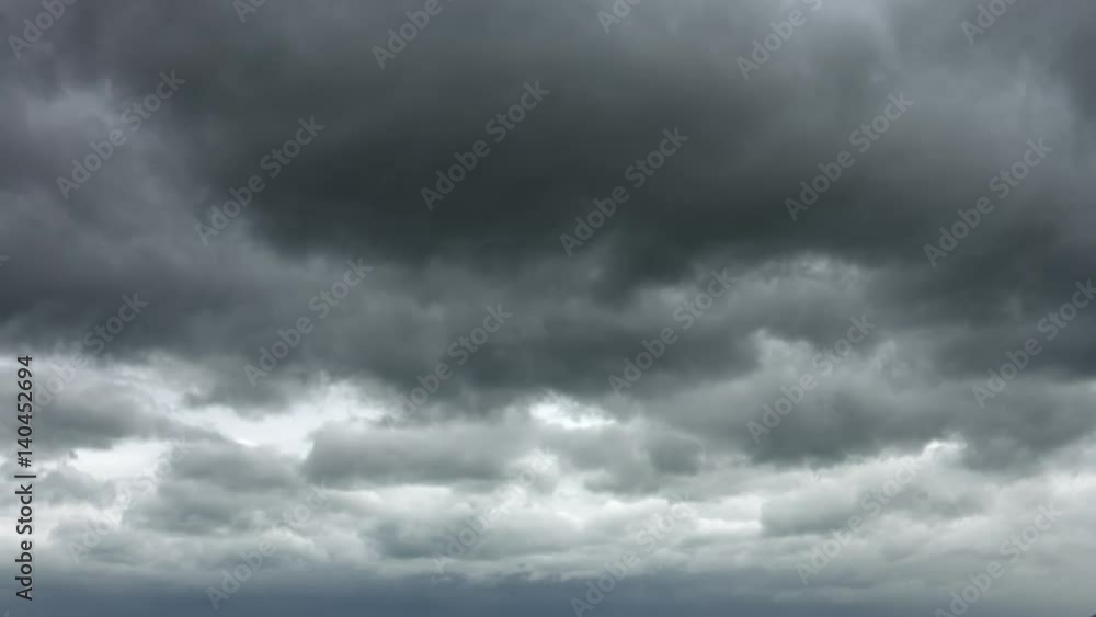 Ominous Gray Clouds drift Slowly across the Sky Ominous Gray Clouds drift Slowly across the Sky