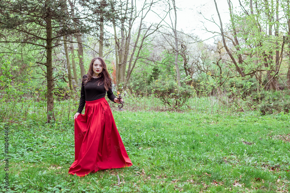 witch in the woods with a candle witch in the woods with a candle