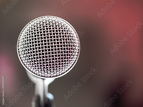 Close up of microphone in karaoke room or conference room. With place your text on background 