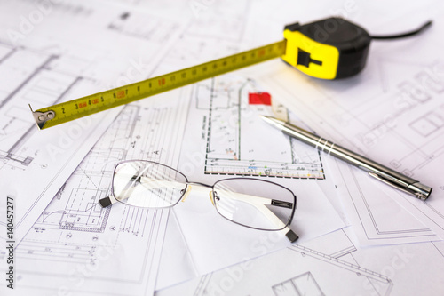 Construction plans on blueprints and measure