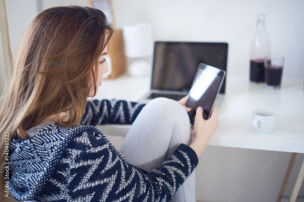Young business girl in her personal workspace working Young business girl in her personal workspace working