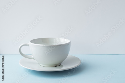 Wallpaper Mural White empty cup for coffee on the blue table Torontodigital.ca