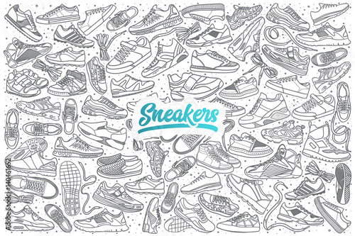 Hand drawn sneakers doodle set background with blue lettering in vector photo