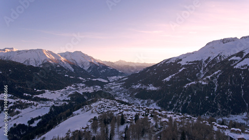 Swiss Alpine village and mountains at sunset