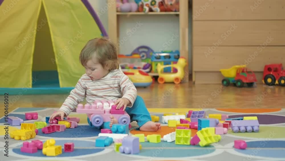 Little Boy Build Toy . Children Kid Baby Play With Blocks. Educational Toys for preschool and kindergarten child. Little Boy Build Toy . Children Kid Baby Play With Blocks. Educational Toys for preschool and kindergarten child.