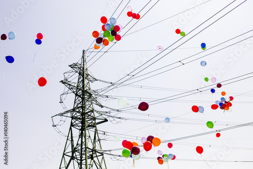 Colorful balloons Flying trough Electrical power lines