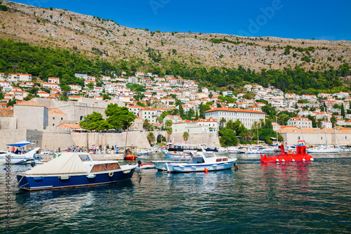 Old port in Dubrovnik and small houses outside the City Walls