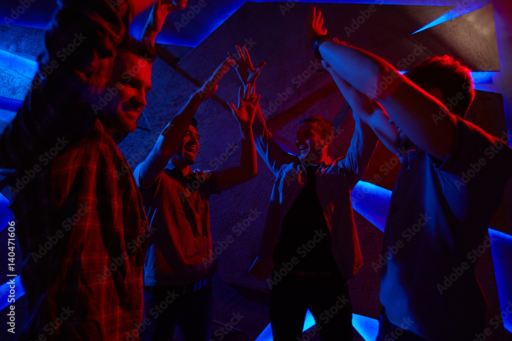 Obraz premium Male dancers raising their arms during dance