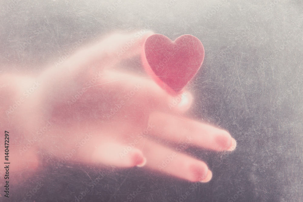 Heart in woman's hand. High resolution.