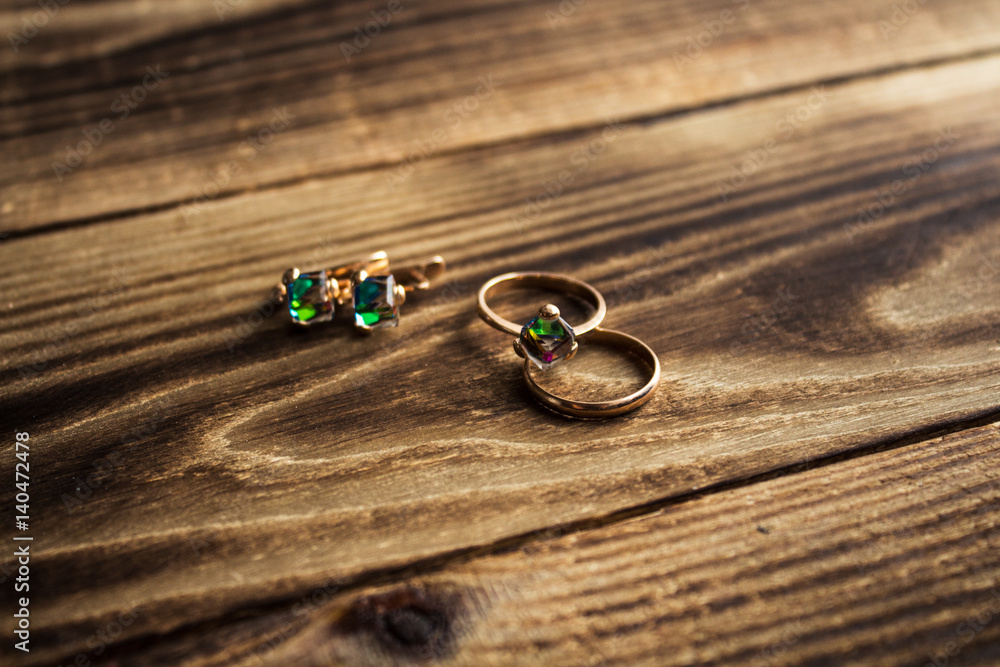 jewerly laying on wooden background jewerly laying on wooden background