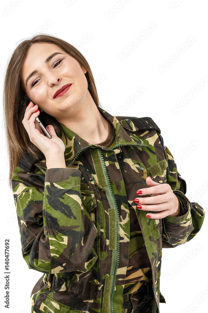 woman soldier with a mobile phone in camouflage military uniform woman soldier with a mobile phone in camouflage military uniform