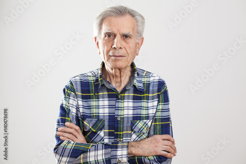 Portrait elderly man on gray background