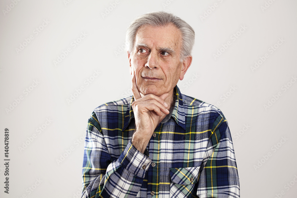 Portrait elderly man on gray background