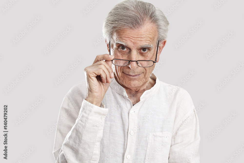 Portrait elderly man on gray background Portrait elderly man on gray background