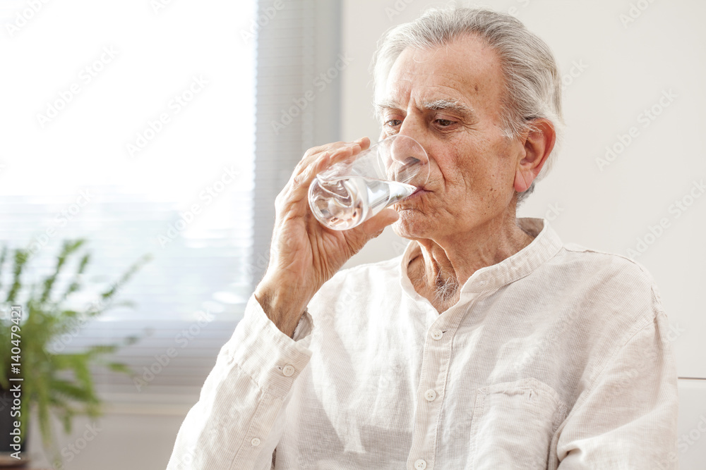 Portrait elderly man drinking water Portrait elderly man drinking water