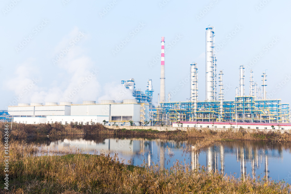 constructions in modern oil refinery near river