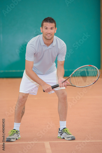 Portrait of man playing tennis © auremar