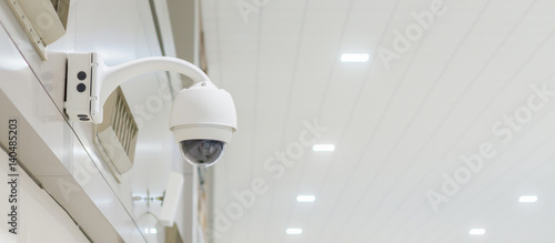 security camera or cctv camera,CCTV or Closed-circuit television Camera Operating inside a airport or train station or department store,selective focus,copy space