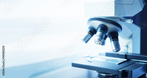 medical laboratory, scientist hands using microscope for chemistry test samples,examining samples and liquid,Medical equipment. microscope,Scientific and healthcare research background.vintage color photo