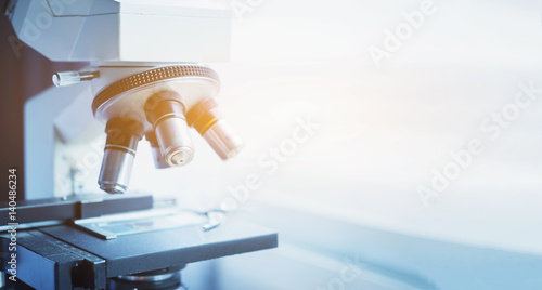 medical laboratory, scientist hands using microscope for chemistry test samples,examining samples and liquid,Medical equipment. microscope,Scientific and healthcare research background.vintage color