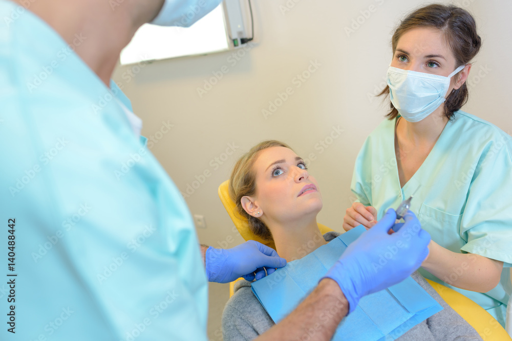 portrait of terrified woman scared at dentist portrait of terrified woman scared at dentist