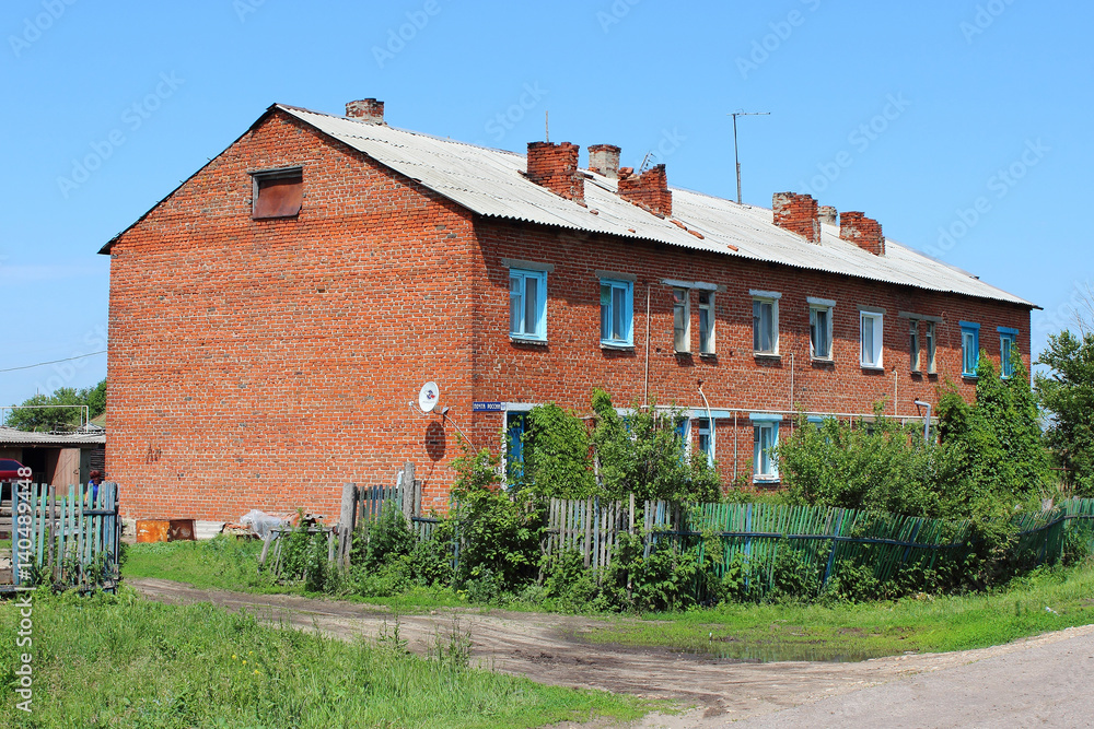 two-storey brick house in the countryside in the summer two-storey brick house in the countryside in the summer