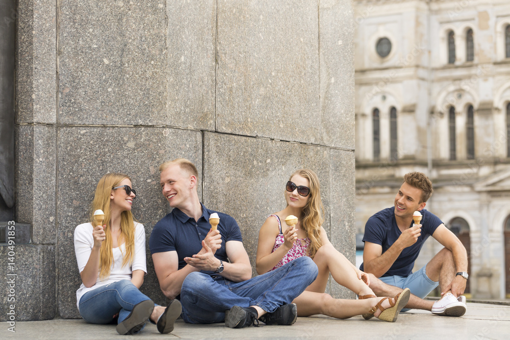 Two couples eating ice creams