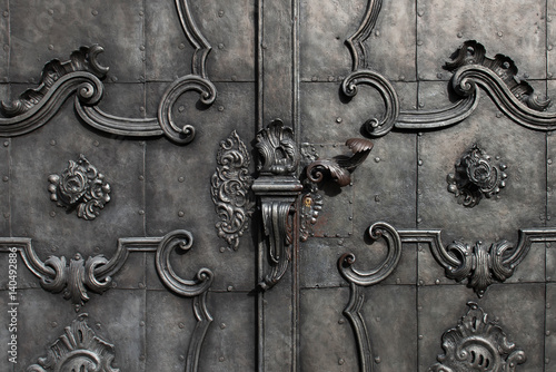 Black iron door with decoration