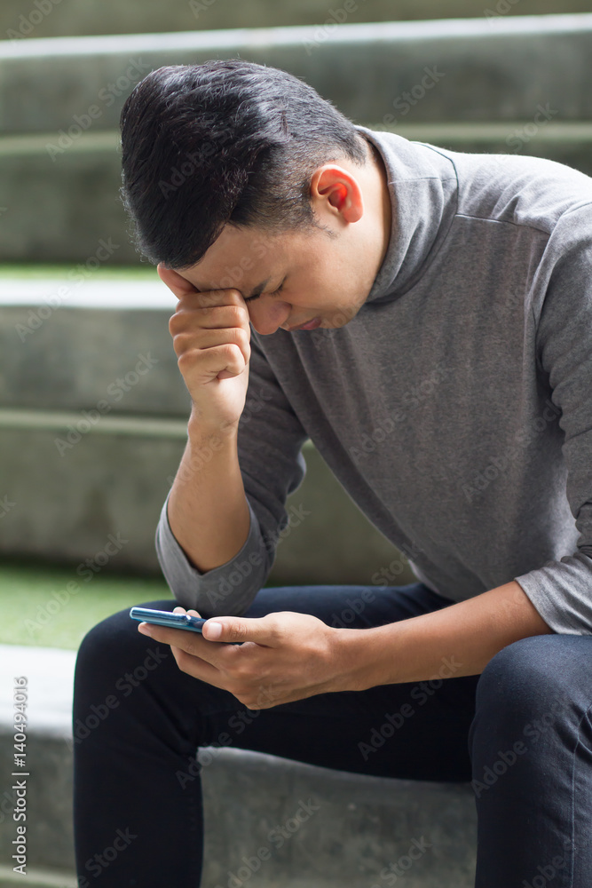 frustrated, surprised, upset, unhappy man using smartphone frustrated, surprised, upset, unhappy man using smartphone