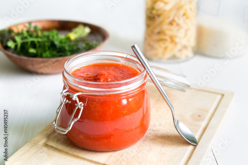 Tomato Sauce In Jar On White Wooden Table