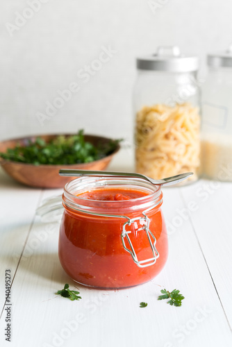 Tomato Sauce In Jar On White Wooden Table