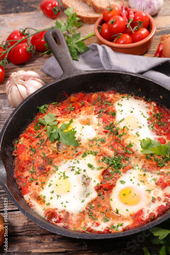 homemade breakfast fried egg with tomato