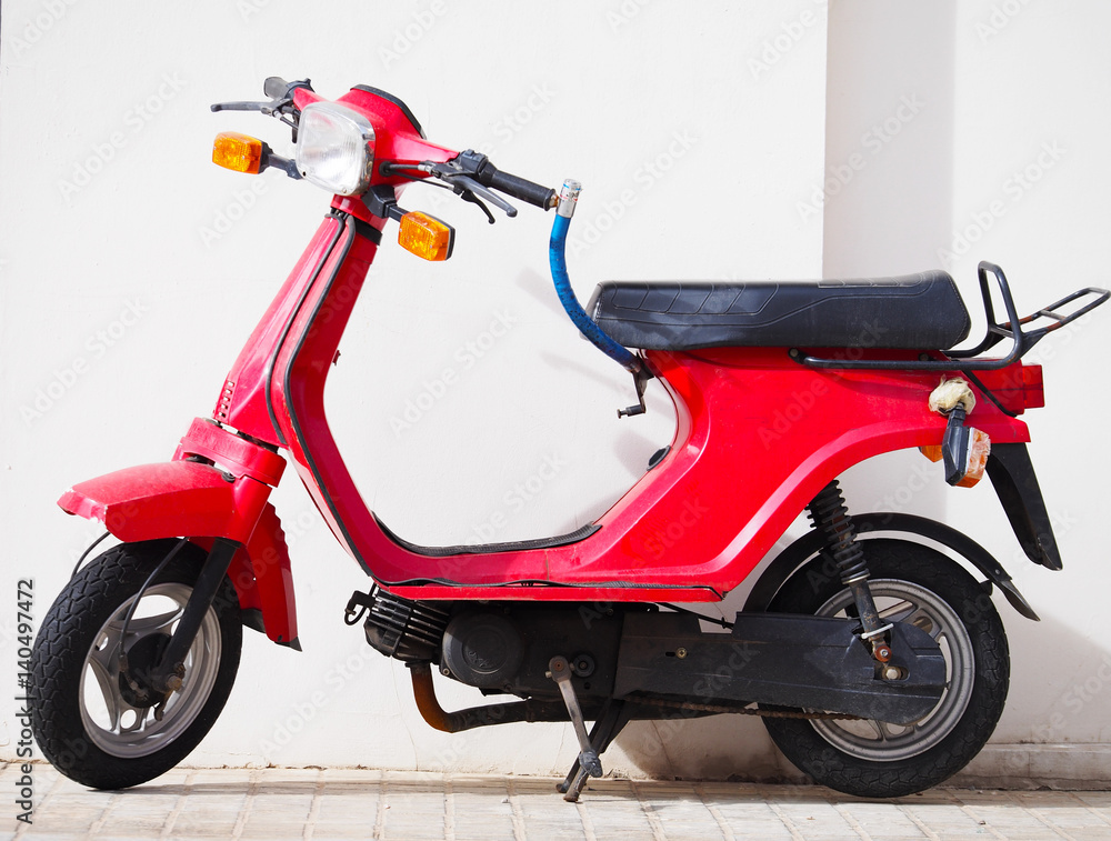 City design: red scooter in the street