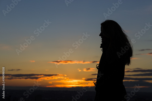 Silhouette of a woman during beautiful sunset.