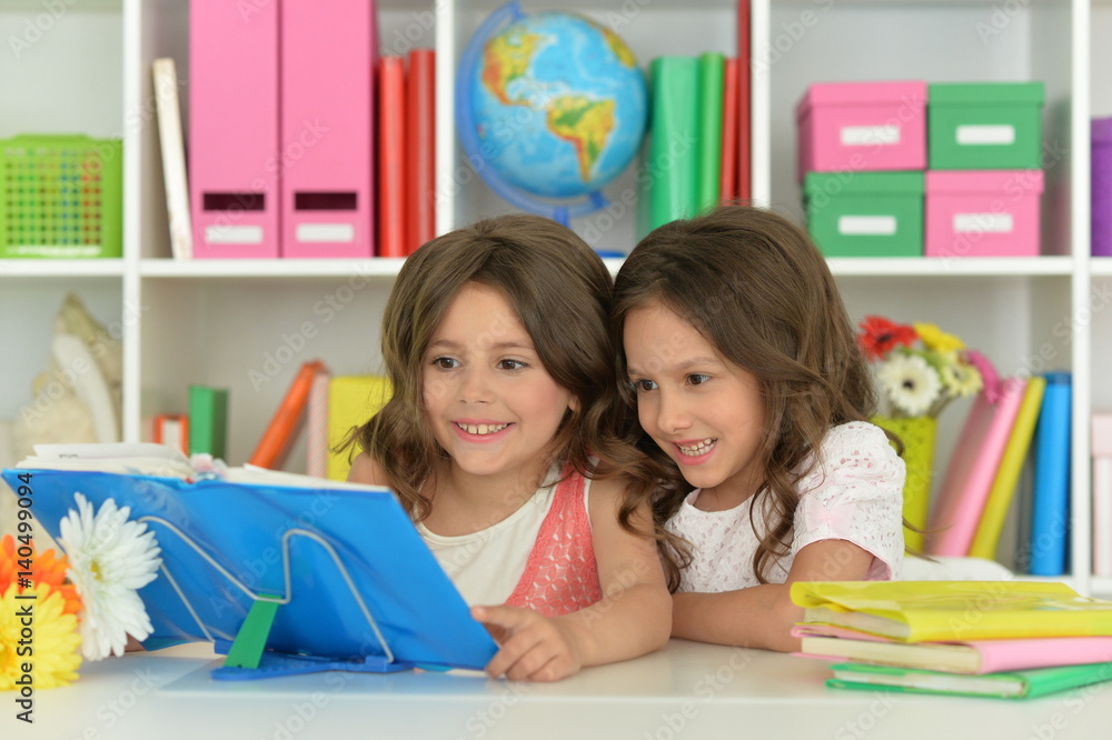 Fototapeta premium Two girls with their homework