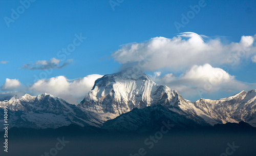 white clouds in the blue sky over the snowy summits of Annapurna,Nepal © марина дворак
