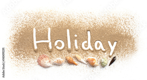 Word holiday written in sand beach on white background