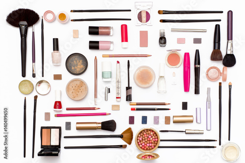 cosmetic makeup brush, nail Polish, face powder, eye shadow, lipstick, mascara, perfume, trimer and other accessories on a white background.