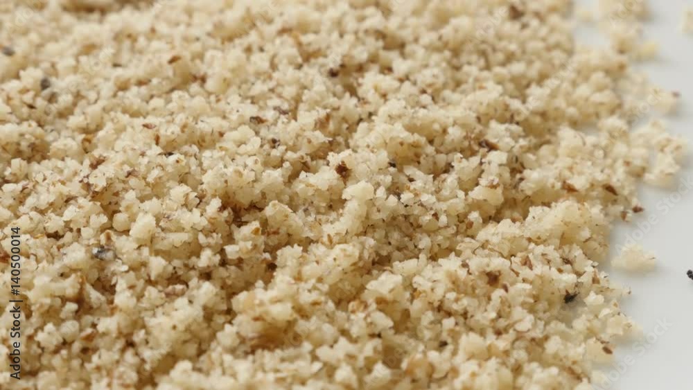 Food background of grinded nuts slow tilt 4K 2160p 30fps UltraHD footage - Chopped walnut seed ready for cake making Food background of grinded nuts slow tilt 4K 2160p 30fps UltraHD footage - Chopped walnut seed ready for cake making