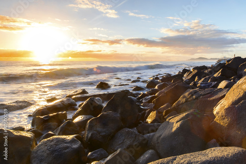 Burleigh Headland rocks and ocean tide at sunrise.