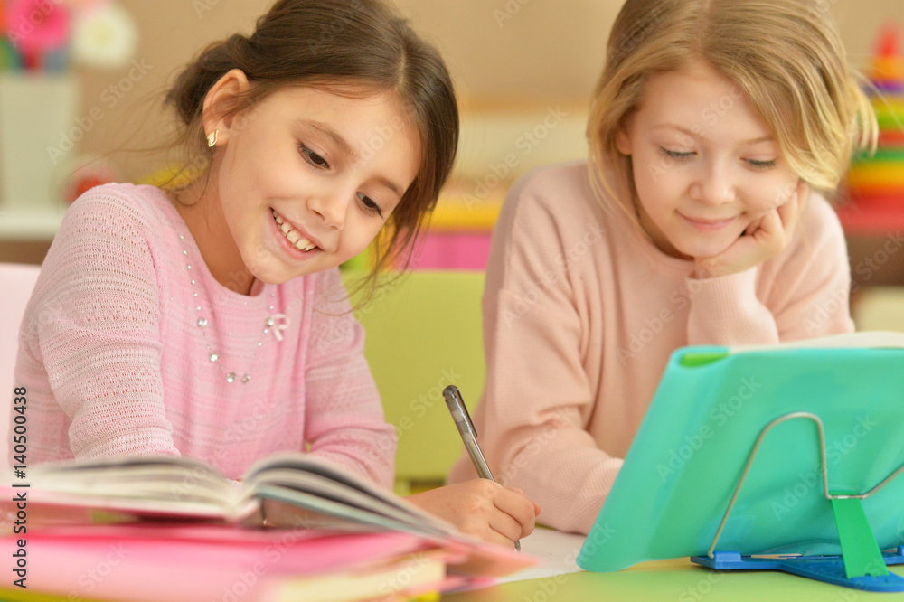 Two girls with their homework Two girls with their homework