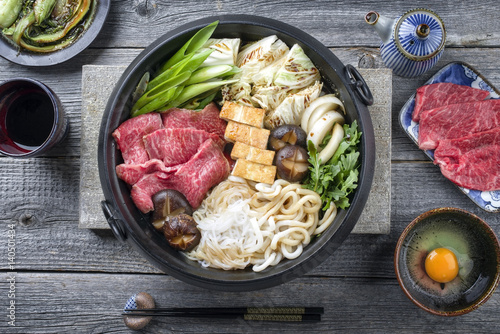 Traditional Japanese Sukiyaki as close-up in a Cast Iron Pot