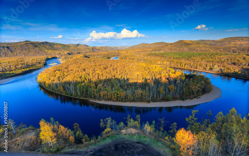 Bairu Island in the middle of winding river, color of autumn in northeast China