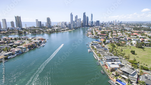 Aerial view of Gold Coast waterways between Macintosh and Cronin Islands with a speed boat heading towards Surfers Paradise © Bostock