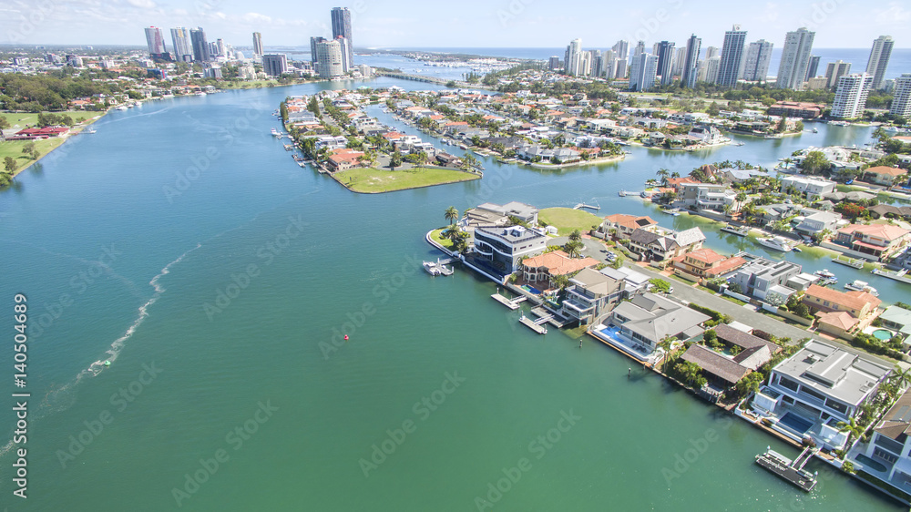 Aerial view with Macintosh island waterfront properties to the right, and surrounds.facing north with Surfers Paradise in the horizon.