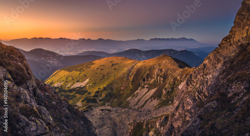 Mountain Landscape in Colourful Sunset. View from Mount Dumbier in Low Tatras, Slovakia. West and High Tatras Mountains in Background. © kaycco