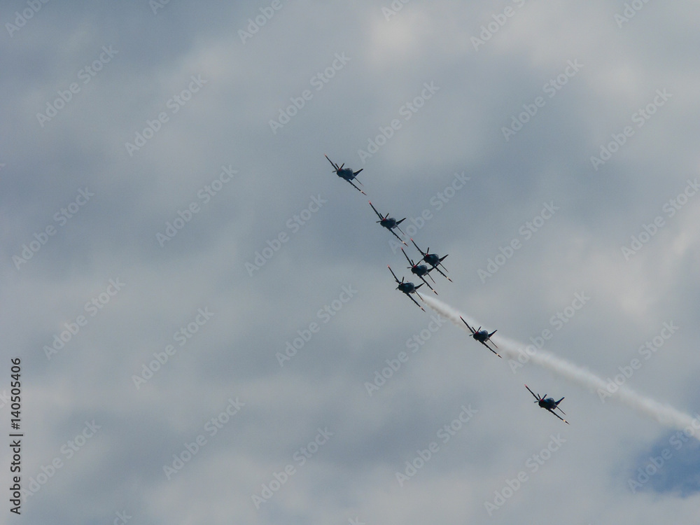 Squadron of fighter jets in clouds on sunny day Squadron of fighter jets in clouds on sunny day