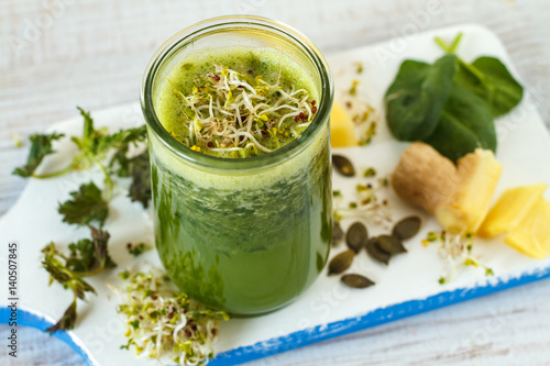 Homemade green smoothie with pineapple, spinach, nettle and ginger